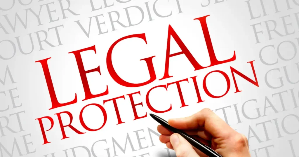 legal protection and a hand holding a pen